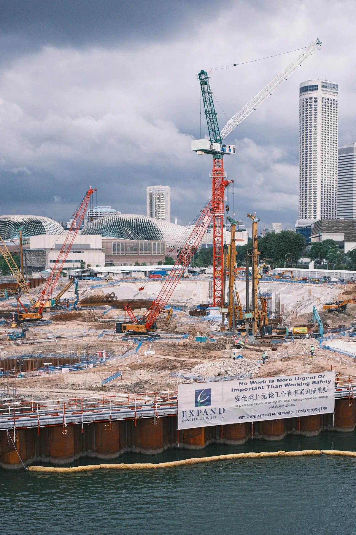 Tower cranes above an active commercial construction site